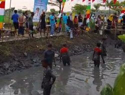 Lomba Menangkap Ikan dalam Rangka Memperingati HUT RI ke-80 di Desa Pungpungan